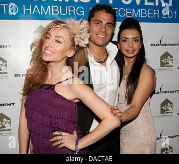 Gabriela Gottschalk (L-R), Silva Gonzales and Diba Hakimi (Pop band Hot Banditoz) arrive to the after match dinner at Weisses Haus restaurant after the 'Match Against Poverty' match in Hamburg, Germany, 13 December 2011. A selection of world soccer players including Ronaldo and Zinédine Zidane played Hamburg SV with a few additional all-stars to collect donations for the United Nat