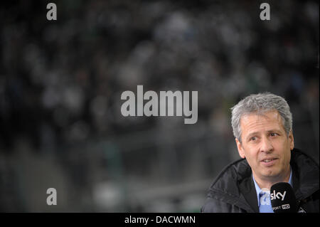 Gladbach's head coach Lucien Favre gives an interview before the German Bundesliga soccer match between Borussia Moenchengladbach and FSV Mainz 05 at the Borussia Park in Moenchengladbach, Germany, 18 December 2011. Photo: Jonas Guettler  (ATTENTION: EMBARGO CONDITIONS! The DFL permits the further  utilisation of the pictures in IPTV, mobile services and other new  technologies onl Stock Photo