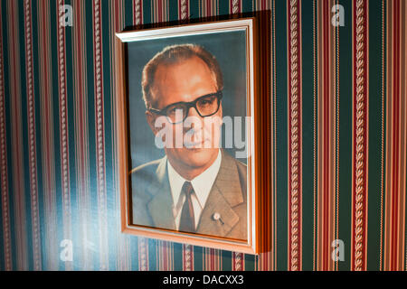 A picture of former head of the German Democratic Republic (GDR)  and general Secretary of the East German Socialist Unity Party, Erich Honecker, is featured in a suite of his hunting residence in Drewitz near Malchow, Germany, 10 November 2011. 22 years after the German reunification, the property, a 14 hectare large area, which was stormed by upset citizens in 1989, will be aucti Stock Photo