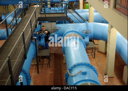 Technician Thomas Klics turns a valve in a resevoir of Bodensee-Wasserversorgung (Lake Constance Water Supply) is pictured in Stuttgart, Germany, 06 December 2011. Lake Constance is the largest and most important fresh water source in Europe. Yearly, over 125 million cubic meters are transported through a ca. 1700 km long pipe network. Photo: Michele Danze Stock Photo