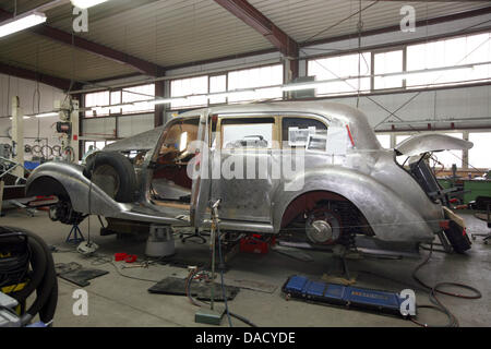 The car body of a Mercedes-Benz 770 from 1941 is situated in an auto repair shop to be restored in Glienick, Germany, 23 November 2011. The company specialises in restoring historcial vehicles. Photo: Nestor Bachmann Stock Photo