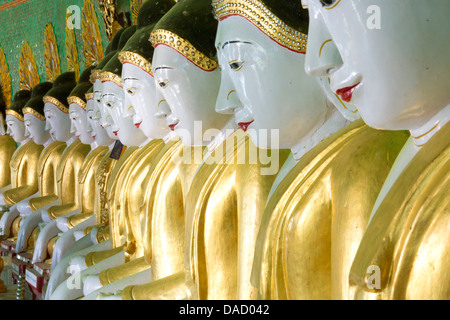 Some of the 45 Buddha images found at a crescent-shaped colonnade at Umin Thounzeh on Sagaing Hill, near Mandalay, Myanmar Stock Photo