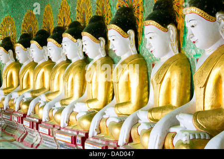 Some of the 45 Buddha images found at a crescent-shaped colonnade at Umin Thounzeh on Sagaing Hill, near Mandalay, Myanmar Stock Photo