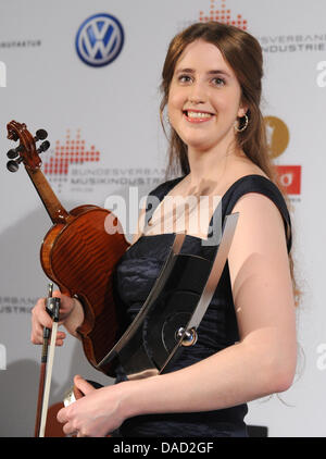 Norwegian violinist Vilde Frang celebrates her award in the category 'Best Young Artist of the Year-Violine' at the Echo Classic Award 2011 held at the concert hall at the Gendarmenmarkt in Berlin, Germany, 02 October 2011. The German Phono Academy awards outstanding interpretations of classical music every year since 1994. The award is featured on German television since 1996 as T Stock Photo