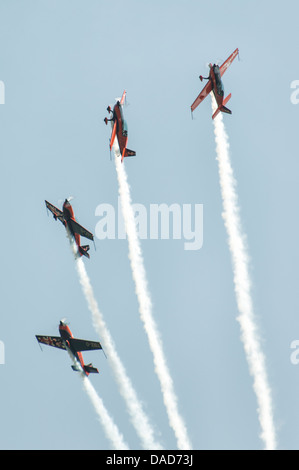 The Blades aerobatic display team execute some precision flying in their Extra 300 performance aircraft at the Waddington Show Stock Photo