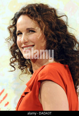 American actress Andie MacDowell prmotes the charity 'Helping Hands' in Berlin, Germany, 14 October 2011. The fast food chain McDonald's has initiated the charity campaign on the occasion of its 40the anniversary to collect money for gravely ill children and their families. Photo: Britta Pedersen Stock Photo