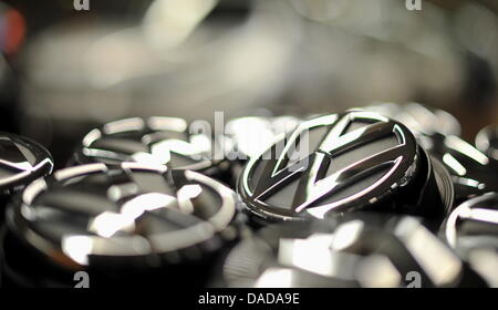 (FILE) An archive photo dated 24 February 2011 shows a number of VW logos next to the Golf and Tiguan production line at the Volkswagen factory in Wolfsburg, Germany. Europe's largest automobile manufacturer has cracked the six million mark of sales for the first time. Photo: Jochen Luebke Stock Photo