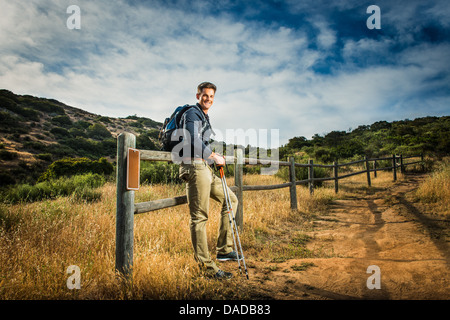Male hiker in rural setting Stock Photo