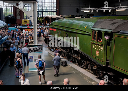 People tourists visitors looking at A4 Pacific Steam Train locomotive at the National Railway Museum York North Yorkshire England UK United Kingdom Stock Photo