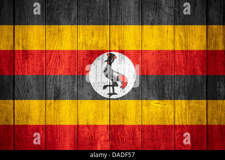flag of Uganda or Ugandan banner on wooden background Stock Photo