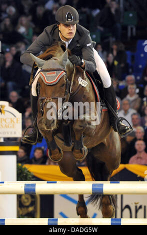 The German equestrian Joerg Oppermann in action on his horse Che Guevara during the German Classics in Hanover, Germany, 23 October 2011. Photo: Jochen Luebke Stock Photo