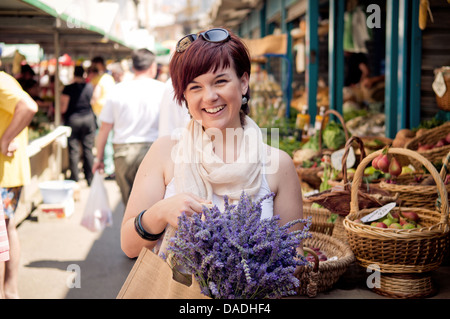 Happy young women at the farmers market Stock Photo