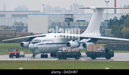 An aircraft of the type Ilyushin Il-76 takes military equipment for the Bundeswehr troops in Afghanistan on board at the air base in Trollenhagen, Germany, 26 October 2011. The German state of Mecklenburg-Western Pomerania will lose 3000 Army personel as part of the reform of the German Armed Forces. The Bundeswehr sites in Trollenhagen, Rechlin, and Luebtheen will be closed comple Stock Photo