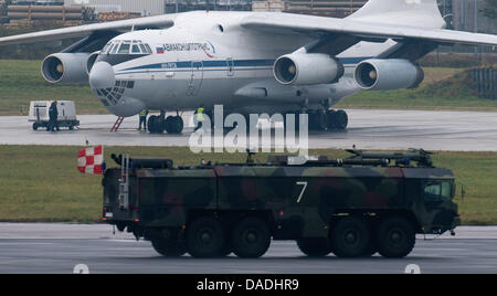 An aircraft of the type Ilyushin Il-76 lands on the airstrip to take military equipment for the Bundeswehr troops in Afghanistan on board at the air base in Trollenhagen, Germany, 26 October 2011. The German state of Mecklenburg-Western Pomerania will lose 3000 Army personel as part of the reform of the German Armed Forces. The Bundeswehr sites in Trollenhagen, Rechlin, and Luebthe Stock Photo