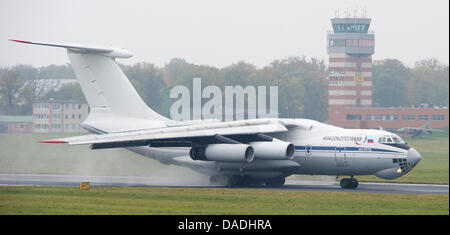 An aircraft of the type Ilyushin Il-76 lands on the airstrip to take military equipment for the Bundeswehr troops in Afghanistan on board at the air base in Trollenhagen, Germany, 26 October 2011. The German state of Mecklenburg-Western Pomerania will lose 3000 Army personel as part of the reform of the German Armed Forces. The Bundeswehr sites in Trollenhagen, Rechlin, and Luebthe Stock Photo