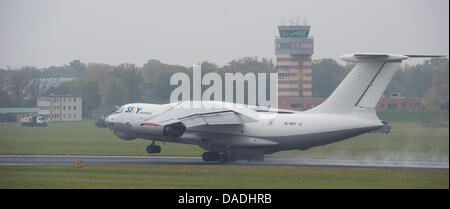 An aircraft of the type Ilyushin Il-76 lands on the airstrip to take military equipment for the Bundeswehr troops in Afghanistan on board at the air base in Trollenhagen, Germany, 26 October 2011. The German state of Mecklenburg-Western Pomerania will lose 3000 Army personel as part of the reform of the German Armed Forces. The Bundeswehr sites in Trollenhagen, Rechlin, and Luebthe Stock Photo