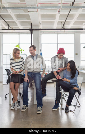 Creative business team sitting together in office Stock Photo