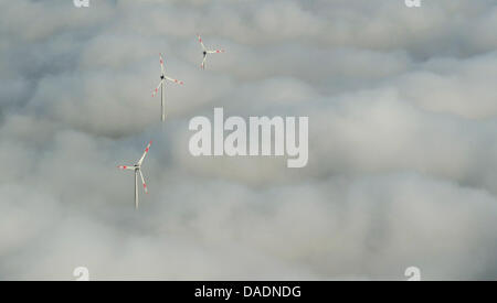 FILE - An archive picture dated 09 October 2011 shows wind turbines reaching out of the fog in Frankfurt/Main, Germany. Hesse's energy summit will meet on 10 November 2011. Photo: Julian Stratenschulte Stock Photo
