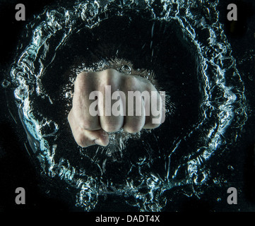 Close up of clenched fist beneath water Stock Photo