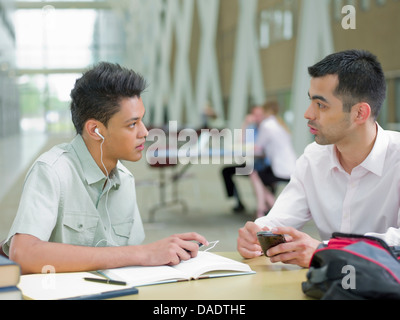 Young man studying with mid adult tutor Stock Photo