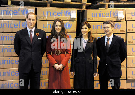 The Duke of Cambridge (L-R), Duchess of Cambridge, Crown Princess of Denmark and Crown Prince of Denmark stand in front of boxes with lifesaving supplies that are to be sent to East Africa at UNICEF's Supply Division in Copenhagen, Denmark, 2 November 2011. The Duke and Duchess of Cambridge (William and Catherine) accompanied by the Crown Prince and Crown Princess of Denmark (Frede Stock Photo