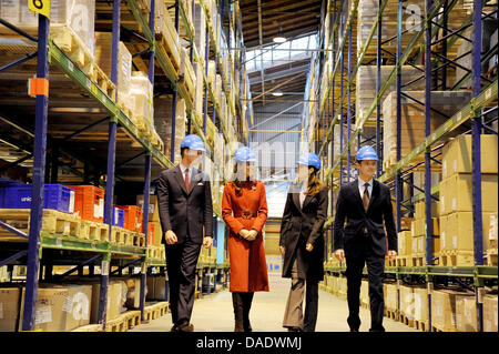 The Duke of Cambridge (L-R), Duchess of Cambridge, Crown Princess of Denmark and Crown Prince of Denmark walk through a storage facility with lifesaving supplies that are to be sent to East Africa at UNICEF's Supply Division in Copenhagen, Denmark, 2 November 2011. The Duke and Duchess of Cambridge (William and Catherine) accompanied by the Crown Prince and Crown Princess of Denmar Stock Photo