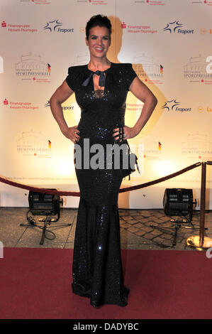 Former ice skater Katarina Witt poses on the red carpet at the 30th German Sporting Press Ball in the old opera house in Frankfurt Main, Germany, 05 November 2011. Photo: MARC TIRL Stock Photo