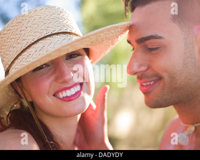 Young woman wearing sun hat and smiling, portrait Stock Photo
