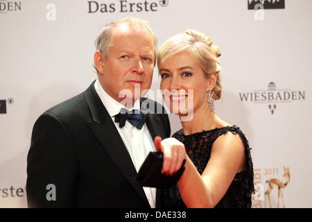 German actor Axel Milberg and his wife Judith arrive for the Bambi award in Wiesbaden, Germany, 10 November 2011. The Bambis are the main German media awards and are presented for the 63rd time. Photo: Michael Kappeler  dpa/lhe Stock Photo