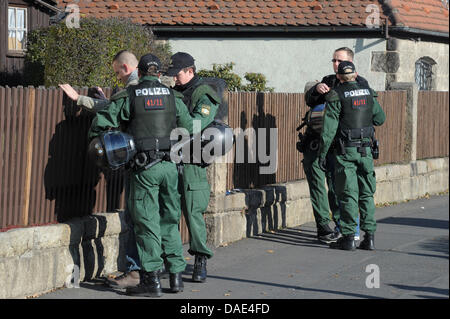 Police officers check participants of a neo-Nazi demonstration in Wunsiedel, Germany, 13 November 2011. More than 350 people attended an inauguration of a memorial site in Wunsiedel and remembered the victims of the death marches from CC Buchenwald to the Concentration Camp in Flossenbuerg. At the same time, around 250 neo-Nazis took part in a demonstration. Photo: DAVID EBENER Stock Photo