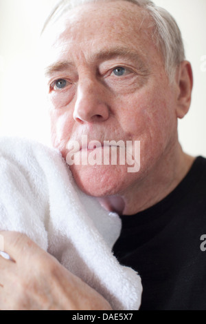 Senior man with white towel Stock Photo