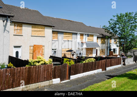 Newtownabbey, Northern Ireland. 11th July 2013. Houses have been boarded up in Ballyduff to protect them against the heat of a nearby bonfire Credit:  Stephen Barnes/Alamy Live News Stock Photo
