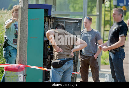 A fully destroyed ticket vending machine is pictured on a platform in the railway station in Kirch Goens near Giessen, Germany, 10 July 2013. A perpetrator used gas to blow-up a railway ticket vending machine to steal an unknown amount of money in the early morning hours. The machines have been targeted in the past months. Photo: BORIS ROESSLER Stock Photo