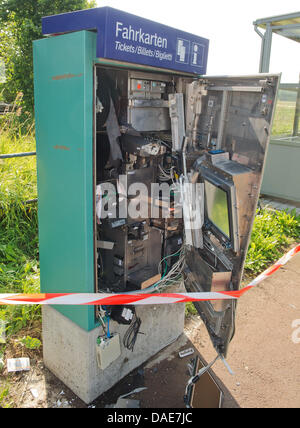 A fully destroyed ticket vending machine is pictured on a platform in the railway station in Kirch Goens near Giessen, Germany, 10 July 2013. A perpetrator used gas to blow-up a railway ticket vending machine to steal an unknown amount of money in the early morning hours. The machines have been targeted in the past months. Photo: BORIS ROESSLER Stock Photo