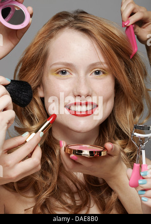 Young woman with make-up artists Stock Photo