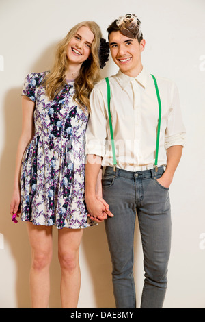 Portrait of young couple holding hands Stock Photo