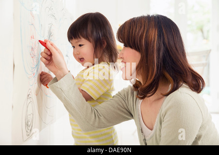 Mother and daughter drawing Stock Photo