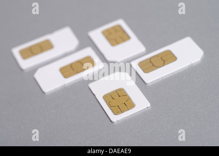 Five mobile phone full size SIM cards Stock Photo