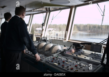 Navigation officer driving cruise liner Stock Photo