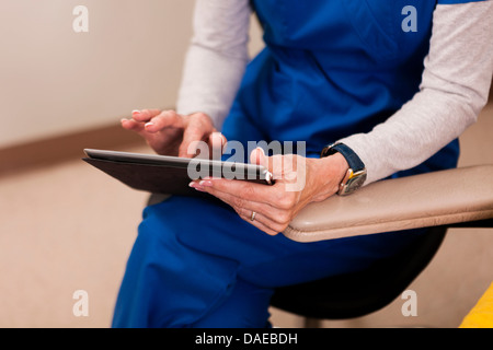 Doctor using digital table, close up Stock Photo