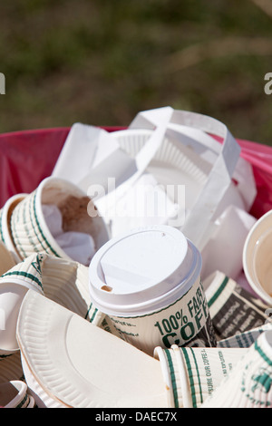 Litter bin full of discarded fair trade coffee cups at country show, England, UK Stock Photo