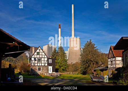 old farm in front of the natural gas and hard coal-fired power station Werdohl-Elverlingsen, Germany, North Rhine-Westphalia, Sauerland, Werdohl Stock Photo