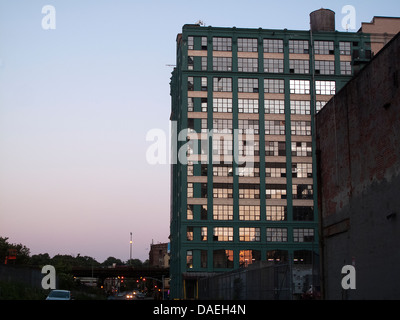 A green building blocks the sunset Stock Photo