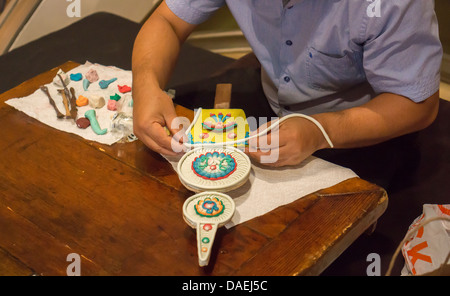 Tibetan tormas, or butter sculptures, being made at an exhibition in New York Stock Photo