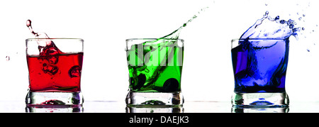Red Green Blue Splash in glass on white Stock Photo
