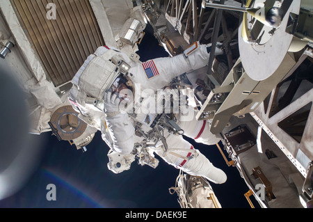 NASA astronaut Chris Cassidy during a spacewalk as work continues on the International Space Station July 9, 2013 in Earth orbit. During the six-hour, seven-minute spacewalk, Cassidy and Parmitano prepared the space station for a new Russian module and performed additional installations on the stations backbone. Stock Photo