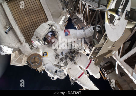 NASA astronaut Chris Cassidy during a spacewalk as work continues on the International Space Station July 9, 2013 in Earth orbit. During the six-hour, seven-minute spacewalk, Cassidy and Parmitano prepared the space station for a new Russian module and performed additional installations on the stations backbone. Stock Photo