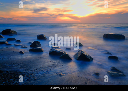 erratic boulders at the Baltic Sea beach in the sunset, Germany, Mecklenburg-Western Pomerania Stock Photo