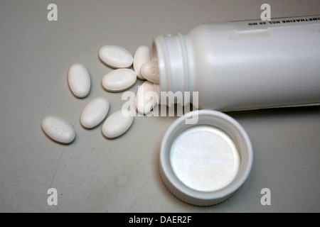 white pills spilling out of white bottle medicine, drug, drugs Stock Photo