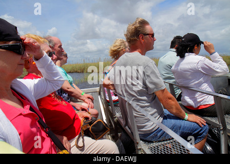 Fort Ft. Lauderdale Weston Florida,Fort Ft. Lauderdale,Sawgrass Recreation Park,Everglades,riders airboat ride,wind,holding onto hat,woman female wome Stock Photo